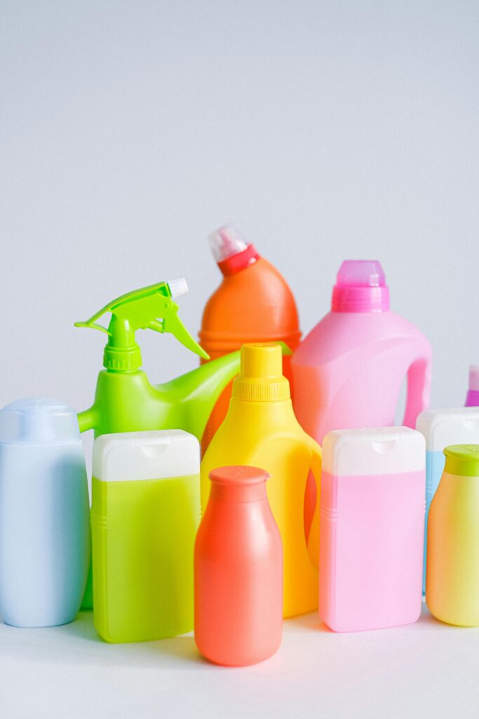 A colorful assortment of cleaning products, including spray bottles and detergent containers, ready for a thorough spring cleaning in North Las Vegas. Perfect for tackling grime and bringing freshness to every corner of your home